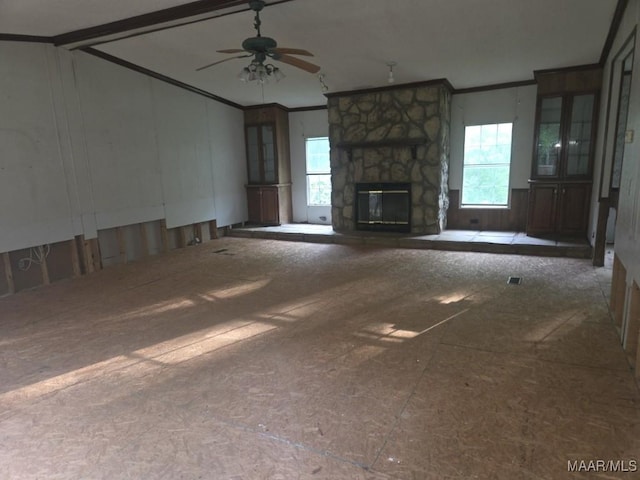 3149 Blackwell Rd, Highland Home, AL 36041 - unfurnished living room featuring healthy amount of natural light, crown molding, a ceiling fan, a fireplace, and lofted ceiling