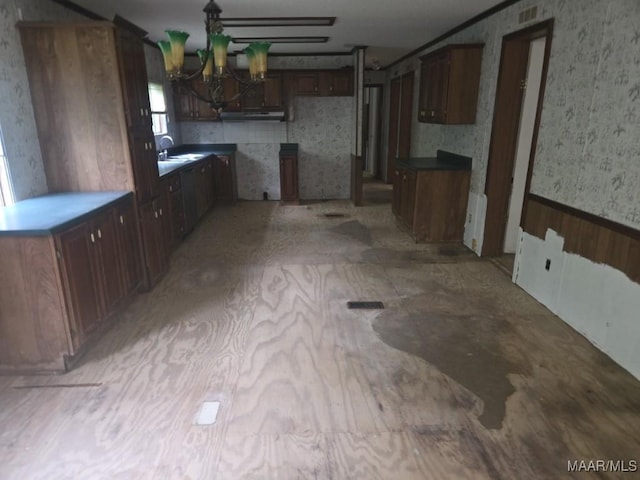 3149 Blackwell Rd, Highland Home, AL 36041 - kitchen with wallpapered walls and a chandelier