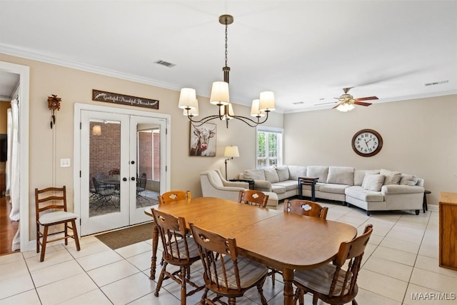 760 Winding Wood Dr, Wetumpka, AL 36093 - dining room featuring light tile patterned floors, ornamental molding, french doors, a chandelier, and a ceiling fan