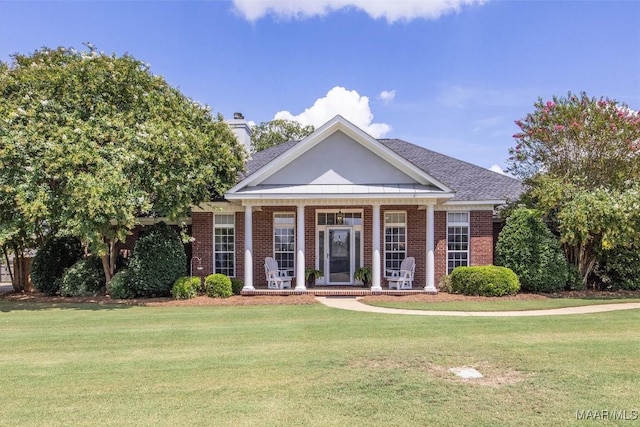 760 Winding Wood Dr, Wetumpka, AL 36093 - greek revival inspired property with a front yard, brick siding, and a chimney