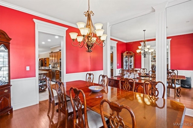 760 Winding Wood Dr, Wetumpka, AL 36093 - dining space with a chandelier, wainscoting, ornamental molding, and wood-type flooring