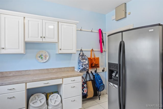 760 Winding Wood Dr, Wetumpka, AL 36093 - kitchen with stainless steel fridge with ice dispenser, light countertops, white cabinetry, and light tile patterned flooring