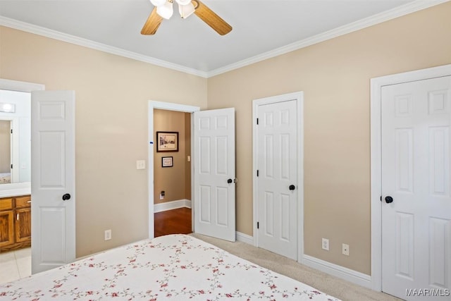 760 Winding Wood Dr, Wetumpka, AL 36093 - bedroom with crown molding, ceiling fan, ensuite bath, and two closets