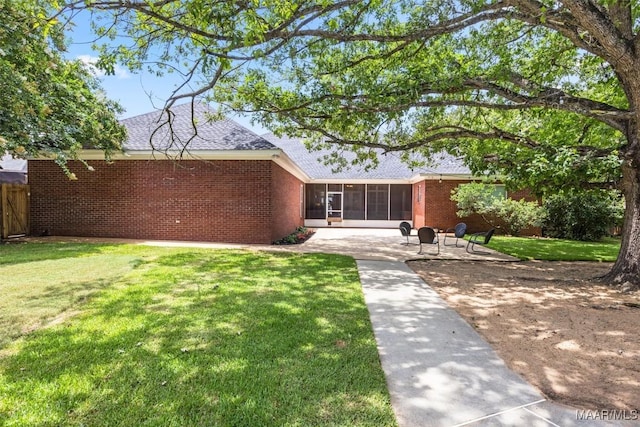 760 Winding Wood Dr, Wetumpka, AL 36093 - rear view of property with a patio area, a sunroom, brick siding, and a shingled roof
