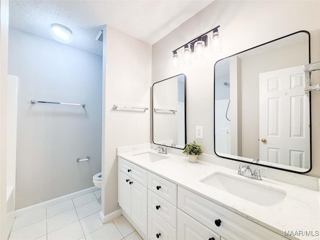9642 Greythorne Way, Montgomery, AL 36117 - full bathroom featuring double vanity, tile patterned flooring, a textured ceiling, and shower / bath combination