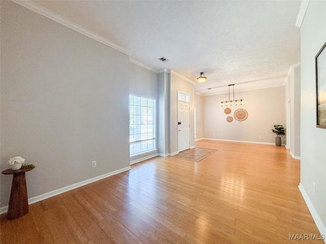 9642 Greythorne Way, Montgomery, AL 36117 - unfurnished room with ornamental molding, light wood-type flooring, and a textured ceiling
