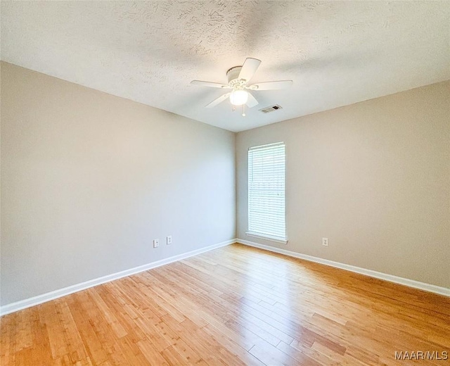 9642 Greythorne Way, Montgomery, AL 36117 - empty room featuring ceiling fan, light wood finished floors, and a textured ceiling