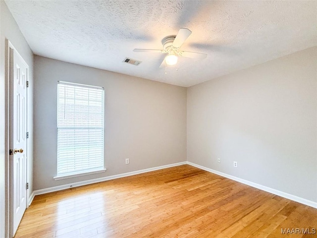 9642 Greythorne Way, Montgomery, AL 36117 - spare room featuring light wood finished floors, a ceiling fan, and a textured ceiling