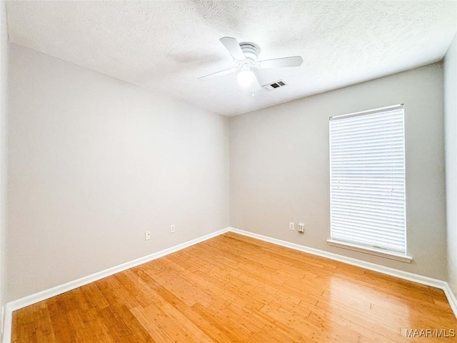 9642 Greythorne Way, Montgomery, AL 36117 - empty room featuring light wood-type flooring, ceiling fan, and a textured ceiling