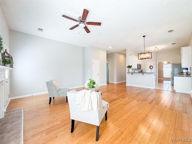9642 Greythorne Way, Montgomery, AL 36117 - sitting room featuring a ceiling fan, light wood-type flooring, and a chandelier
