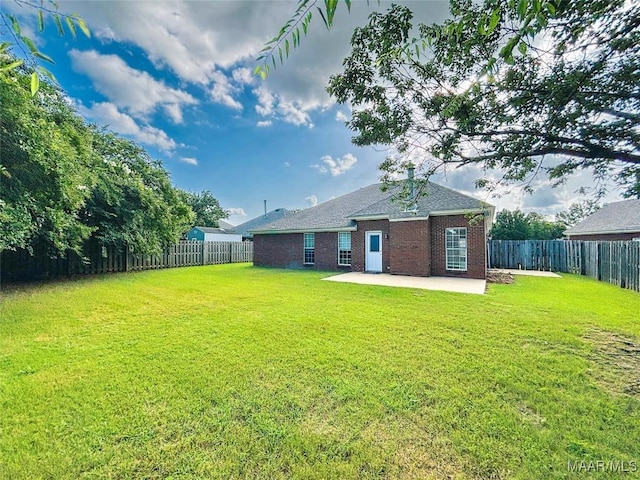 9642 Greythorne Way, Montgomery, AL 36117 - back of house with a patio area, a fenced backyard, brick siding, and a shingled roof
