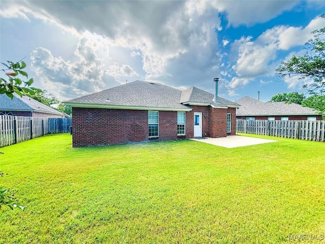 9642 Greythorne Way, Montgomery, AL 36117 - rear view of property with a patio, a fenced backyard, brick siding, and roof with shingles
