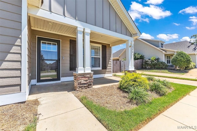 2285 Gathering Way, Prattville, AL 36066 - view of exterior entry with board and batten siding and a porch