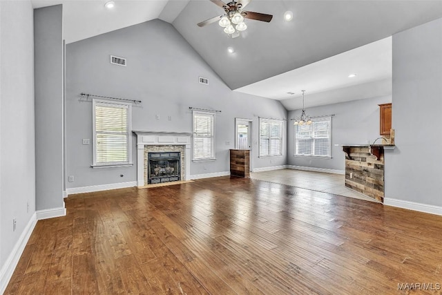 2285 Gathering Way, Prattville, AL 36066 - unfurnished living room featuring ceiling fan, a chandelier, a fireplace, wood finished floors, and recessed lighting