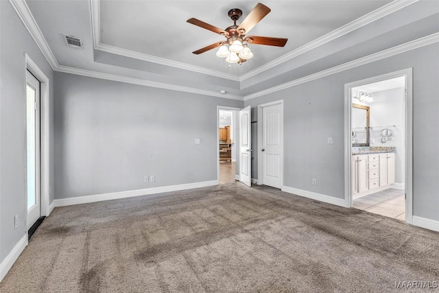 2285 Gathering Way, Prattville, AL 36066 - unfurnished bedroom featuring carpet floors, a raised ceiling, crown molding, ensuite bathroom, and ceiling fan