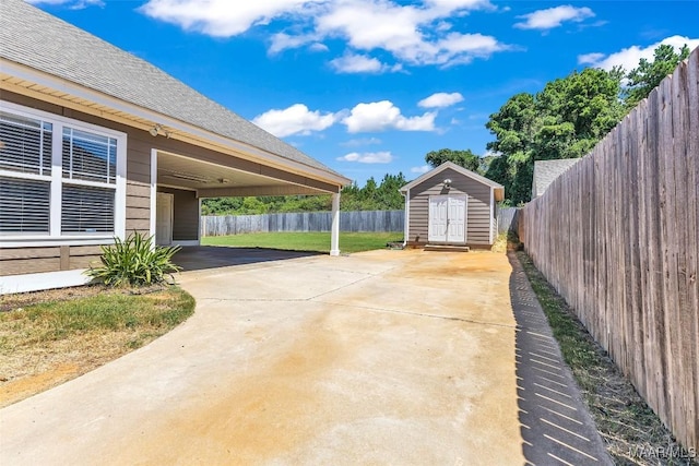 2285 Gathering Way, Prattville, AL 36066 - fenced backyard featuring a shed, a patio, driveway, and a carport