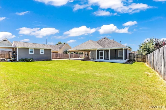 2285 Gathering Way, Prattville, AL 36066 - rear view of house featuring a sunroom, a fenced backyard, an attached carport, and a patio