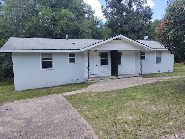 ranch-style house with a front lawn