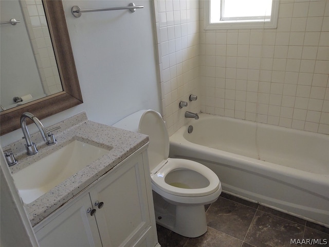 full bathroom with tiled shower / bath combo, vanity, tile floors, and toilet