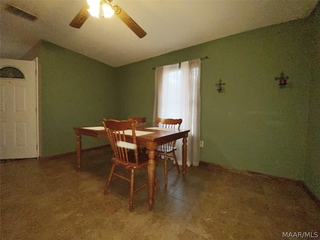 dining area featuring tile floors and ceiling fan