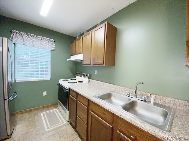 kitchen with sink, stainless steel fridge, light tile floors, and electric range