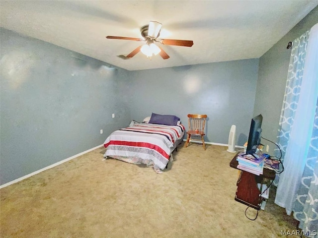 bedroom with ceiling fan and carpet