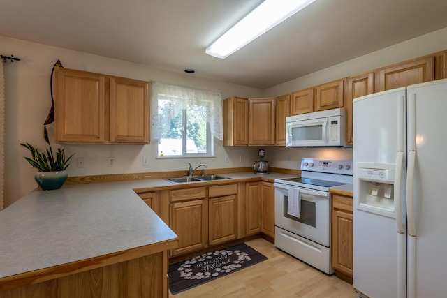 772 Cedar St, Whitefish, MT 59937 - kitchen featuring white appliances, a sink, light countertops, and light wood-style flooring