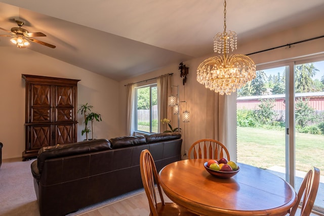 772 Cedar St, Whitefish, MT 59937 - dining room featuring vaulted ceiling, a chandelier, and a ceiling fan