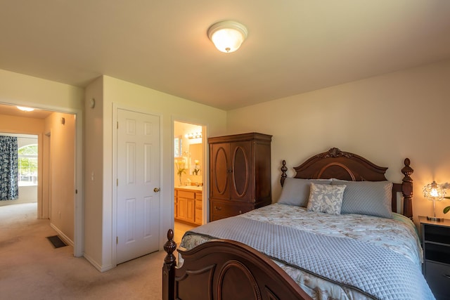 772 Cedar St, Whitefish, MT 59937 - bedroom with light colored carpet, baseboards, and connected bathroom
