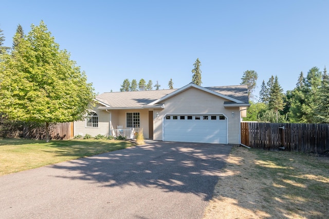 772 Cedar St, Whitefish, MT 59937 - ranch-style house featuring driveway and a garage