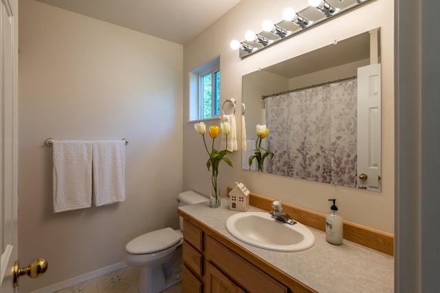 772 Cedar St, Whitefish, MT 59937 - full bath with vanity, toilet, and baseboards