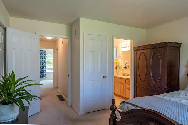772 Cedar St, Whitefish, MT 59937 - bedroom featuring light colored carpet, ensuite bath, and a sink