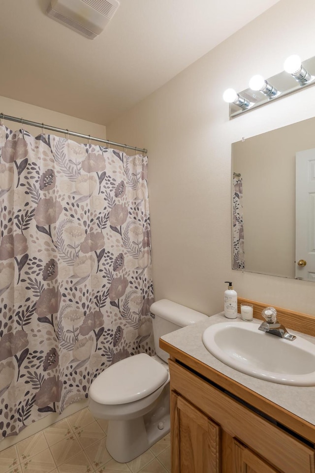 772 Cedar St, Whitefish, MT 59937 - bathroom with vanity, toilet, and a shower with shower curtain