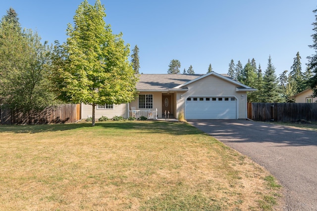 772 Cedar St, Whitefish, MT 59937 - single story home featuring driveway, an attached garage, and a porch