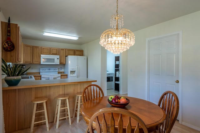 772 Cedar St, Whitefish, MT 59937 - dining space with a chandelier and light wood-style floors