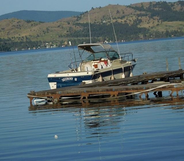 view of dock featuring a water and mountain view