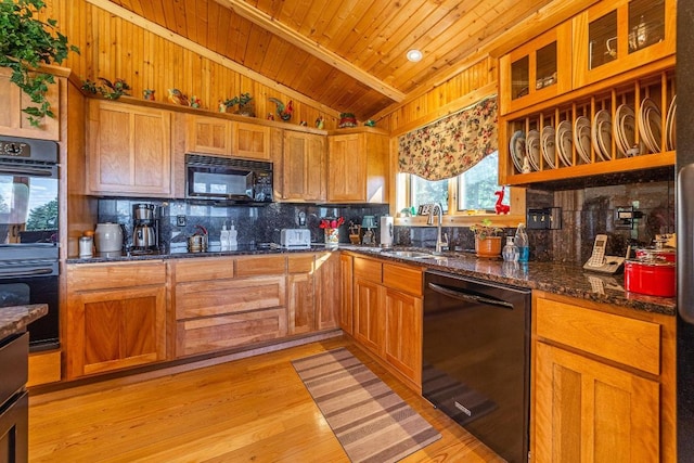 kitchen with wooden ceiling, light hardwood / wood-style flooring, black appliances, sink, and vaulted ceiling