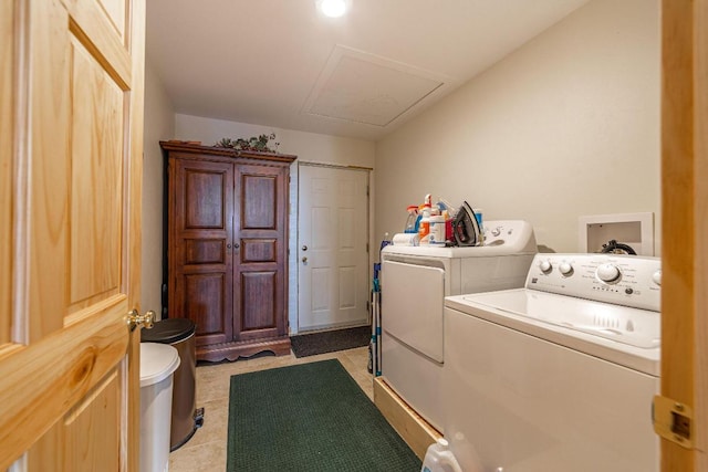 washroom featuring light tile flooring and separate washer and dryer