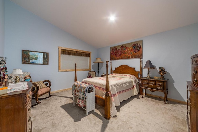 carpeted bedroom with lofted ceiling