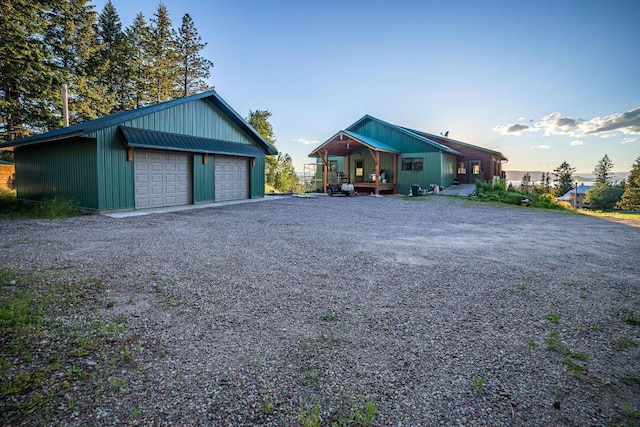 view of front of property featuring a porch and a garage