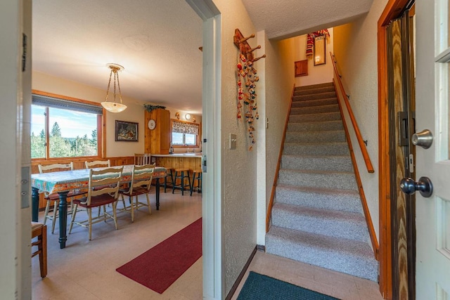 stairs featuring light tile floors