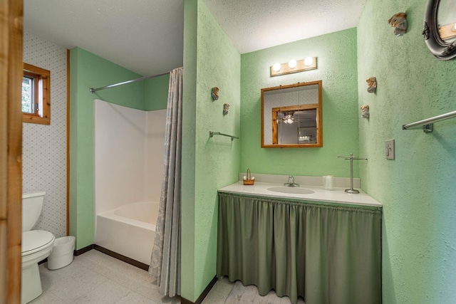 full bathroom featuring tile flooring, shower / bath combination with curtain, a textured ceiling, toilet, and vanity