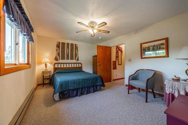 bedroom featuring light colored carpet, a baseboard radiator, ceiling fan, and a textured ceiling