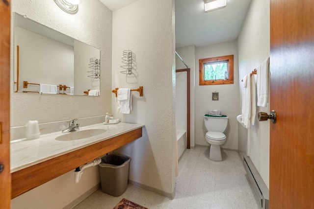 full bathroom featuring baseboard heating, tile floors, toilet, and bathing tub / shower combination