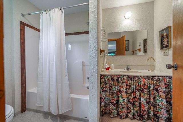 full bathroom featuring shower / tub combo, toilet, and vanity