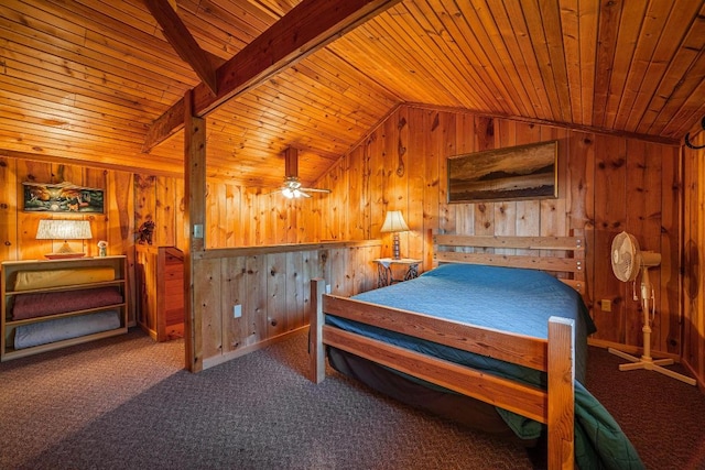 bedroom with lofted ceiling, wood walls, dark colored carpet, and wood ceiling