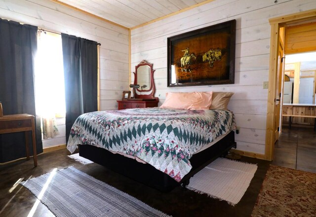 bedroom with wooden walls