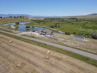 birds eye view of property with a rural view