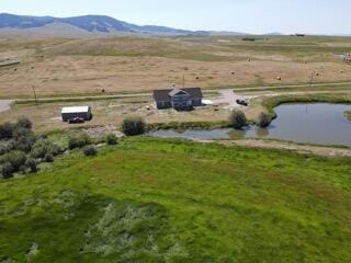 aerial view featuring a rural view and a mountain view