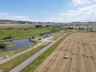 aerial view with a rural view and a water view